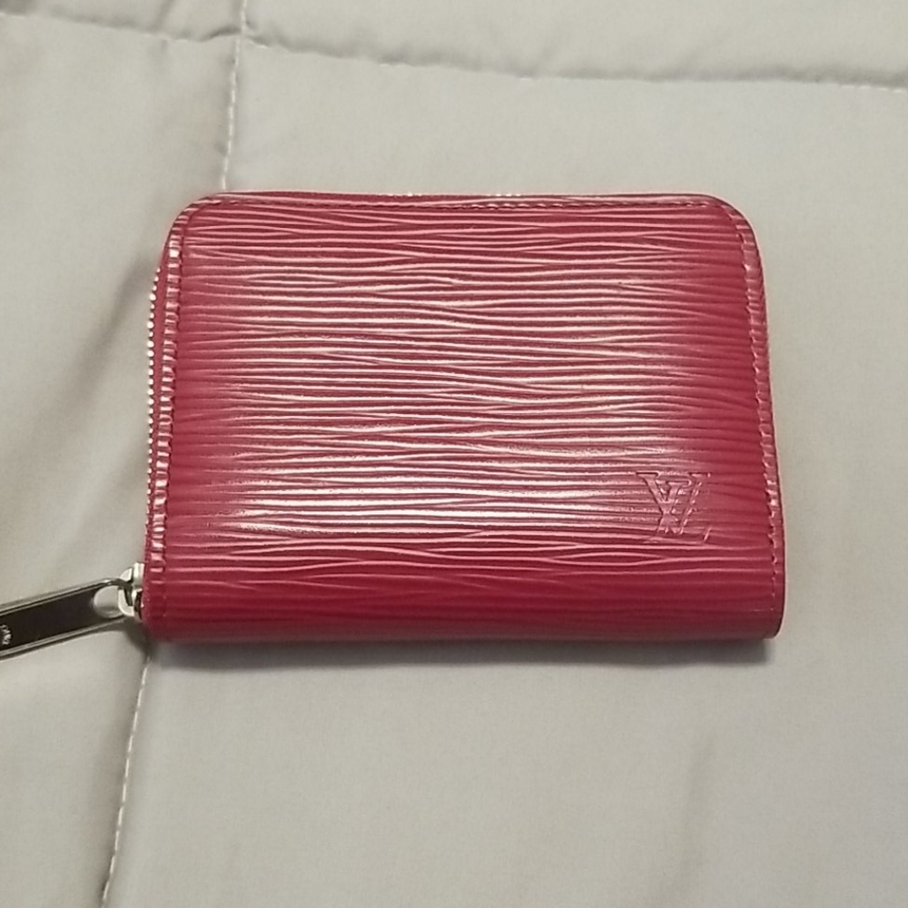 Authentic Louis Vuitton zip around wallet.